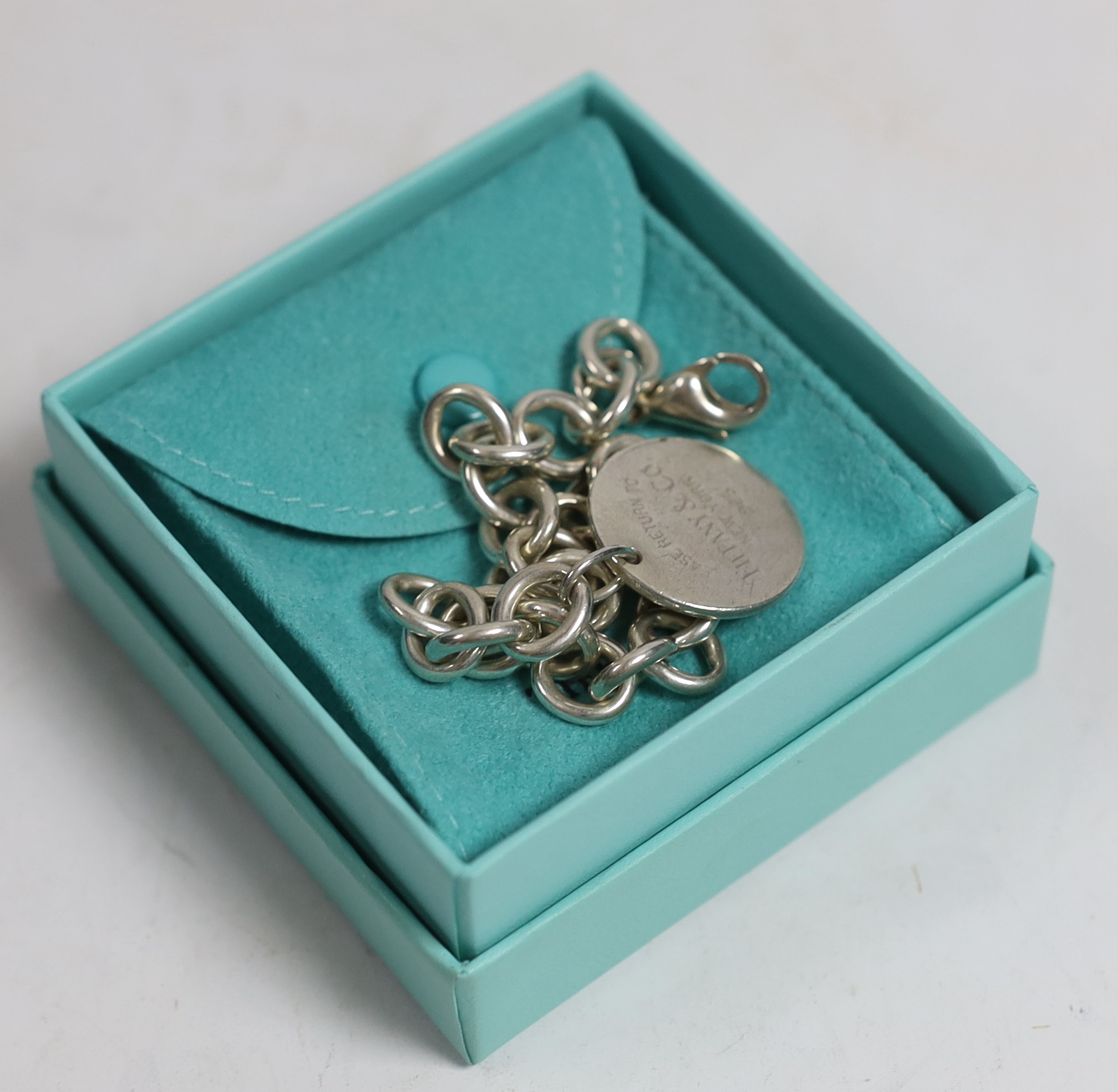 A Tiffany & Co sterling circular link bracelet with tag, 20cm excluding tag, with Tiffany pouch and box.